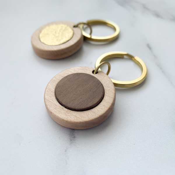Vannucchi Jewellery's pale white wood, round key ring with brass or walnut inlay
