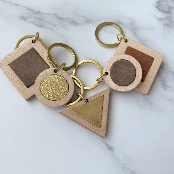 Collection of five types of wood based key rings created by Vannucchi Jewellery