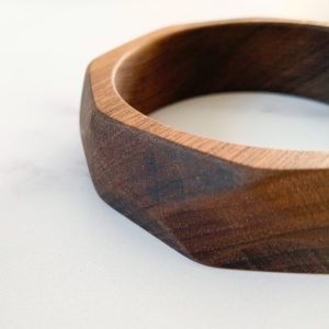 Left edge of Maria multi angled walnut bangle