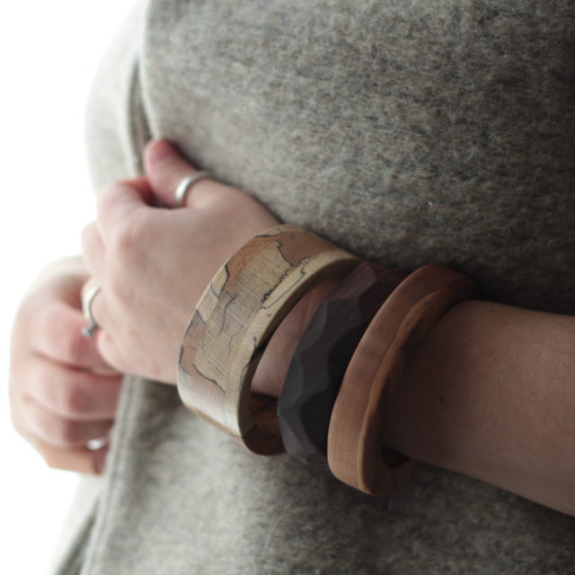 Vannucchi Jewellery model wears three different wooden bangles