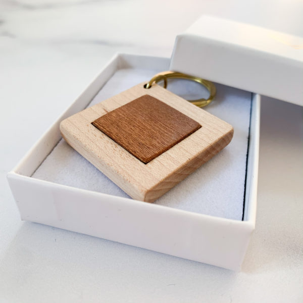 Pale white wood square key ring with Mahogany inlay, displayed in Vannucchi Jewellery branded box