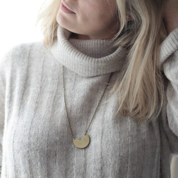 Vannucchi Jewellery model wears Lynny brass and wood, sector shaped, long chain necklace