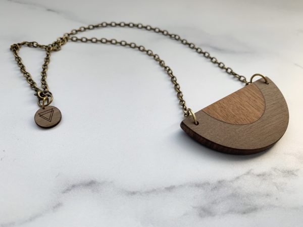 Vannucchi Jewellery, Alba Rose necklace from an angle, showing contrasting wood and brand tag