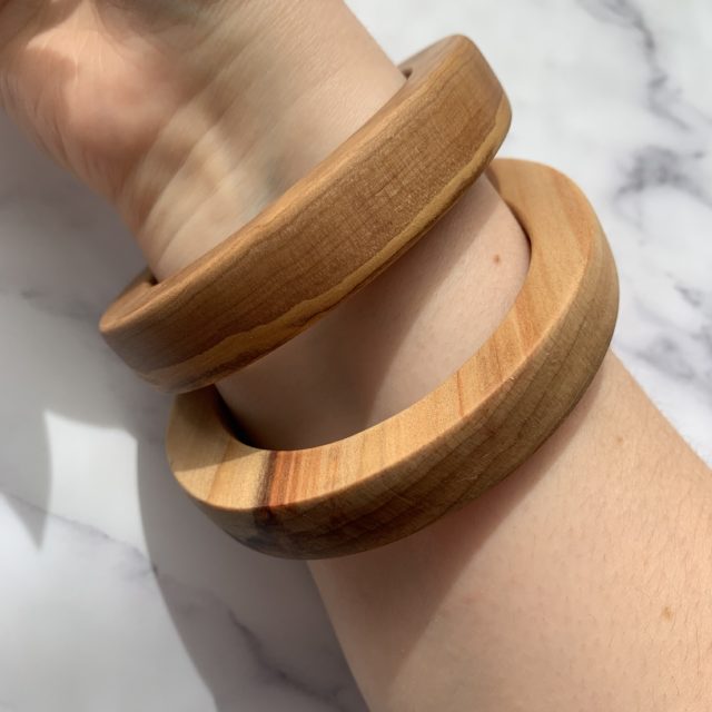 Close up shot of Vannucchi Jewellery model wearing sara parana pine wood bangle