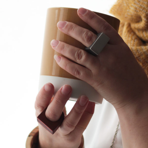 Vannucchi’s wooden rings displayed on hand model