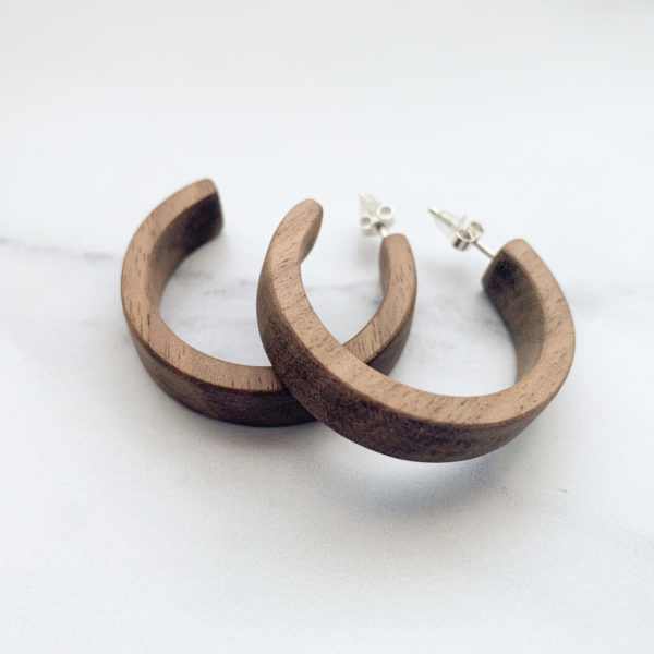 Vannucchi Jewellery, Sarah walnut wood, hooped earrings lie overlapping
