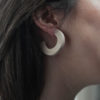 Close up of Vannucchi's Claire, maple wood, thick hoop earring