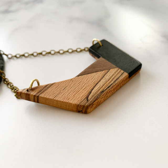 Side shot of the Unita wood geometric necklace created by Vannucchi Jewellery