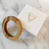Vannucchi Jewellery's Sara Parana Pine wood bangle displayed with branded box