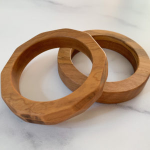 Splayed Vannucchi Jewellery olive wood bangles.