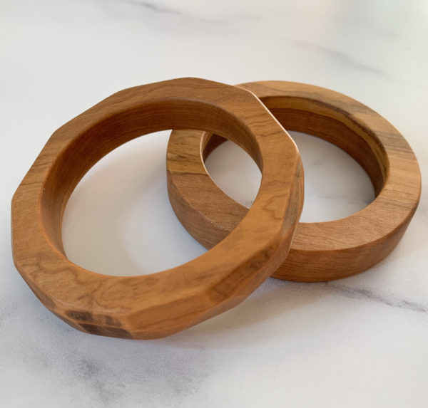 Splayed Vannucchi Jewellery olive wood bangles.