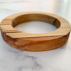 Close up shot of red colours running through Sara parana pine wood bangle created by Vannucchi Jewellery