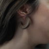 Close up of Vannucchi's Claire, walnut wood, thick hoop earring