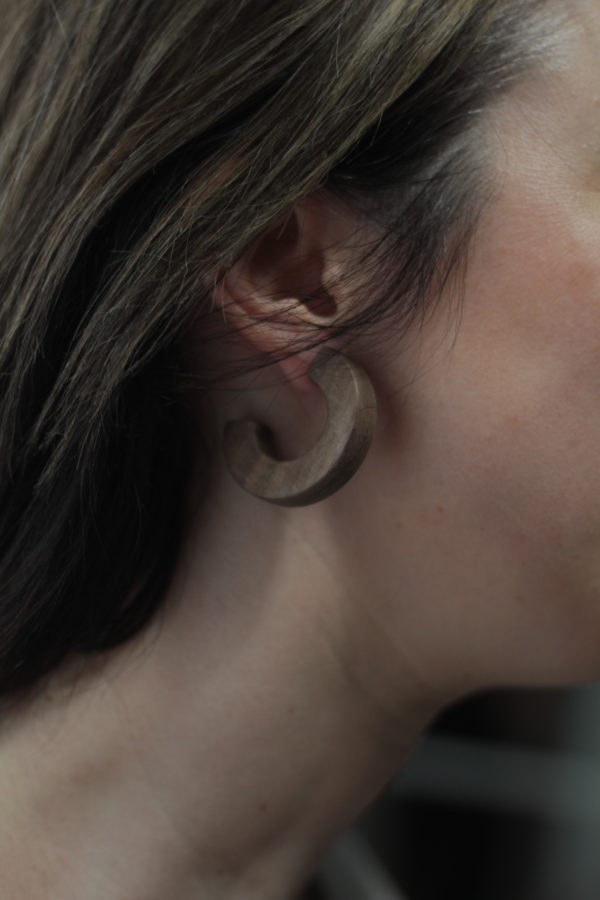 Close up of Vannucchi's Claire, walnut wood, thick hoop earring