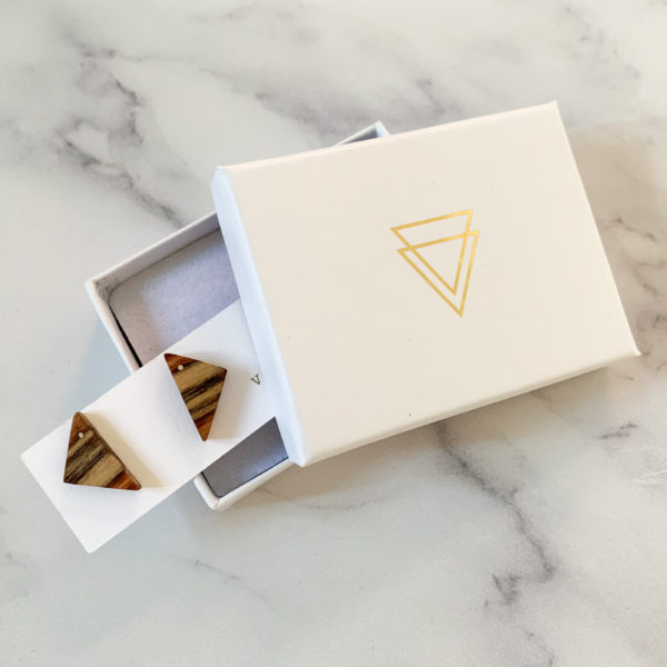 Vannucchi Jewellery's Nana parana pine, triangle shaped studs, displayed in branded box