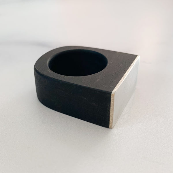 Square top, black, ebony wood ring with Silver metal top, angled to the right