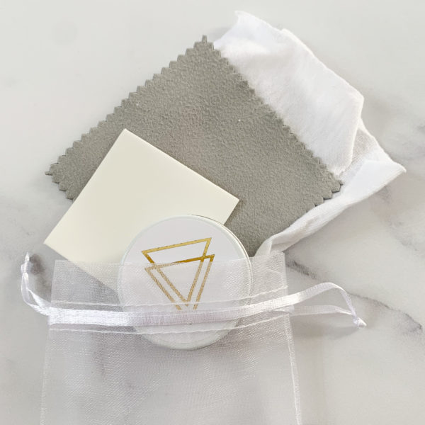 Vannucchi product care package, showing contents of polishing cloths and organic beeswax