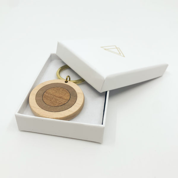 Round mixed wood key ring in Vannucchi branded packaging