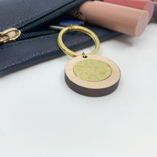 textured brass and wood key ring on key in purse