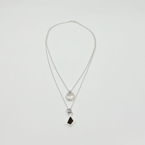 Collezione XXI, fine sterling silver, black diamond, multi layered necklace. Displayed on white background.