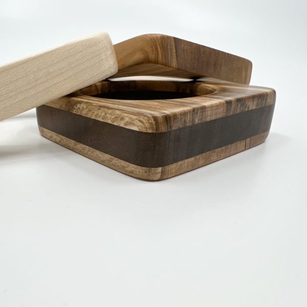 Stack of square bangles with Marta mixed wood square bangle on white background