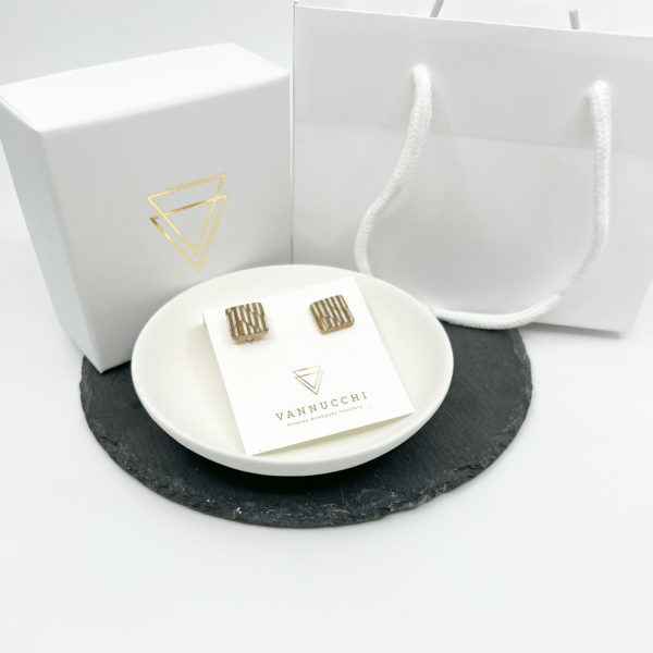 Stripes wood square cufflink displayed with white Vannucchi branded packaging. Set on white background.