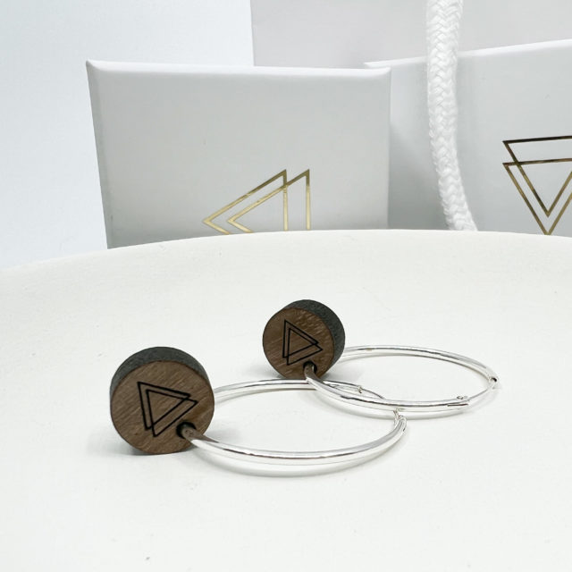 Vannucchi Hoops displayed on white dish with branded boxes in background. Boxes are White with metallic gold V icon.