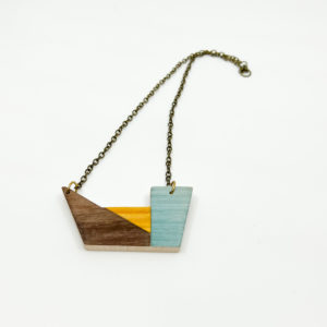 Summer delight Vannucchi wooden geometric necklace. Maple Base with brown, blue and yellow geometric marquetry. Birds Eye View.