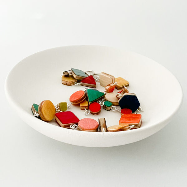 Collezione XXIII Multi Coloured Dreams Necklace displayed in white dish on white background.