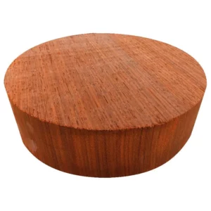 Round cut block of red wood known as Padauk.